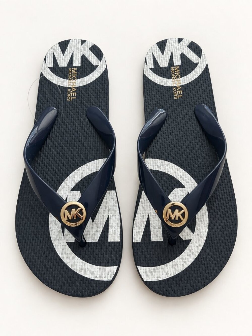 Michael Kors black/white Flip Flops with Gold MK Emblem